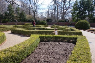 Charlotte chasing grandma in the Boxwood Garden